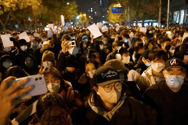 Protesters march during a rally against China's harsh COVID-19 restrictions in Beijing on Nov. 28. NOEL CELIS/AFP VIA GETTY IMAGES
