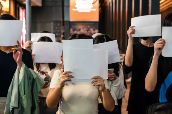People hold sheets of blank paper in protest of Covid-19 restrictions on mainland China in Hong Kong on Monday.Anthony Kwan / Getty Images