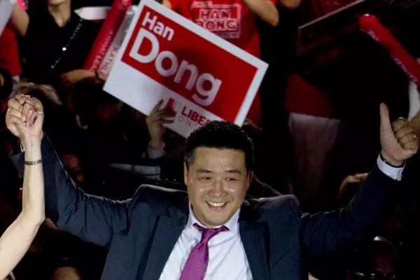 Han Dong celebrates with supporters while taking part in a rally in Toronto on May 22, 2014. The Toronto member of Parliament is denying a report that alleges China helped him win a 2019 Liberal candidate nomination contest. (Nathan Denette/The Canadian Press)