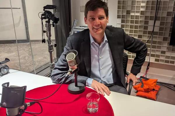 B.C. Premier David Eby sitting comfortably with a smile in his face