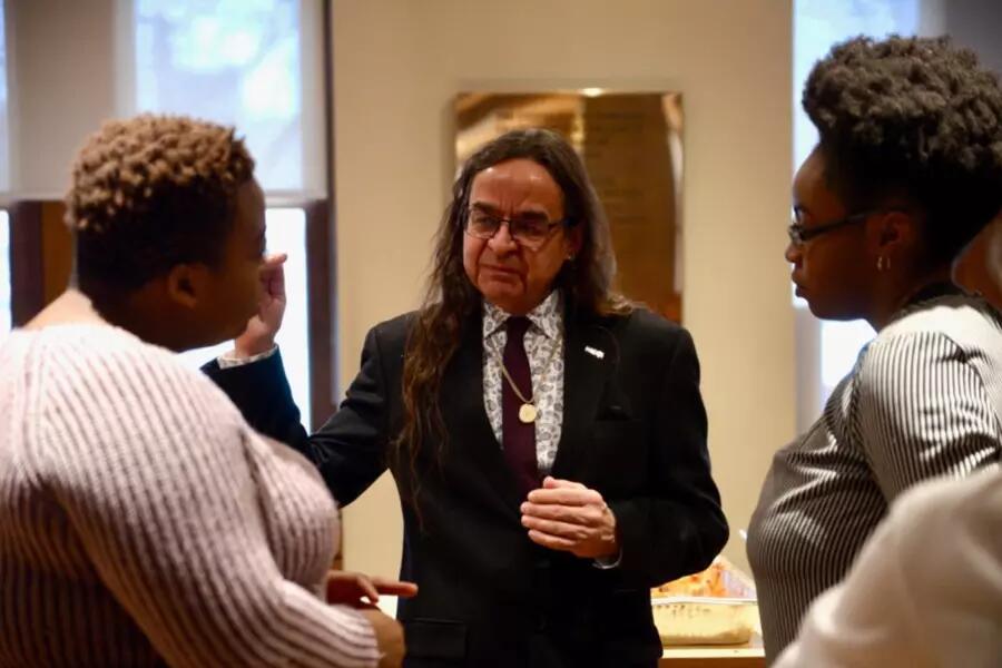 Elder Cat Criger speaking with attendees after Friday’s keynote address
