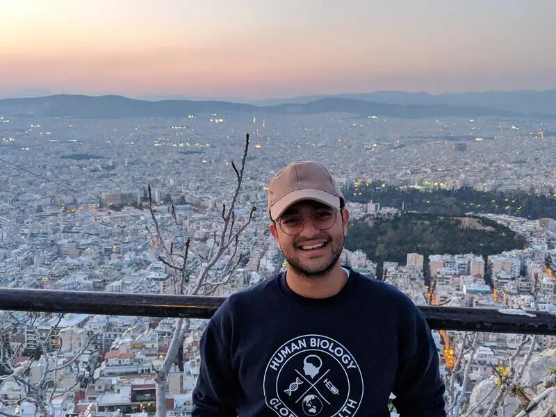 PCJ student Rushay Naik with Athens cityscape in the background