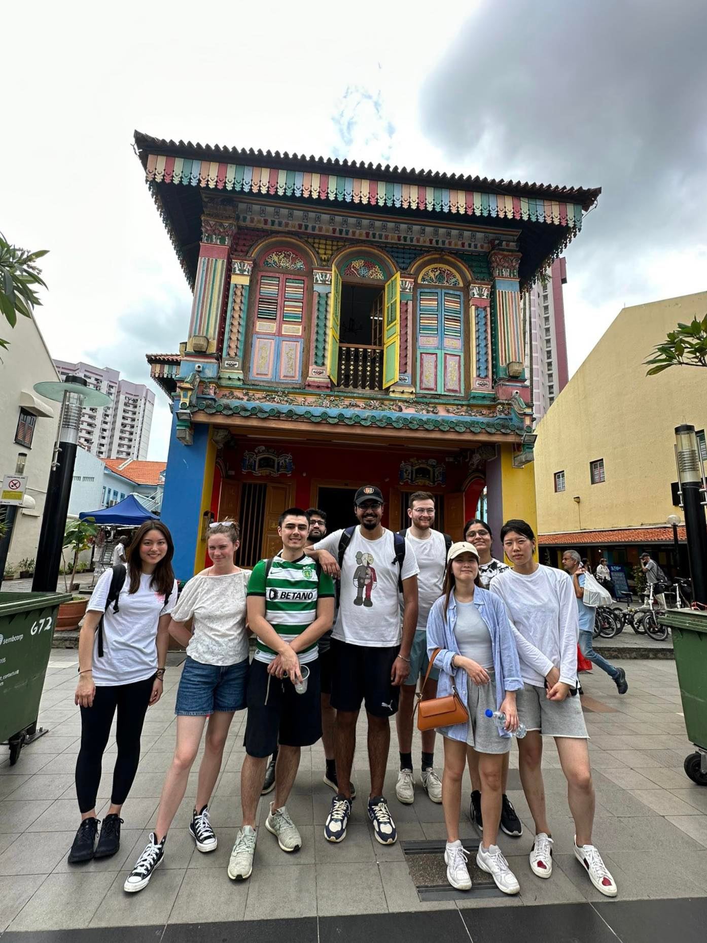 Image of participating ICM students in front of a building in Singapore’s Chinatown.
