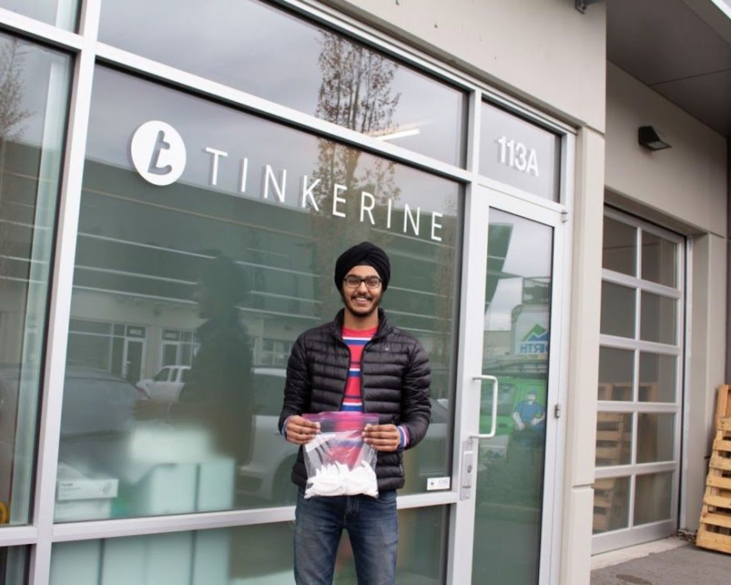 Abhay Sachal holding a bag of medical equipment.