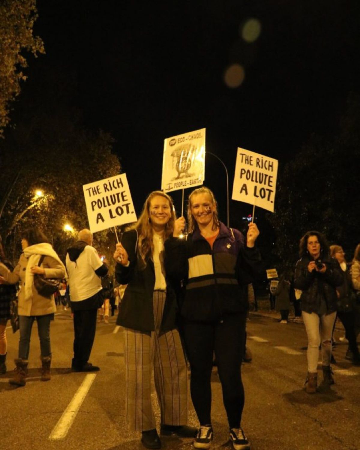 The author and a friend at a climate protest.