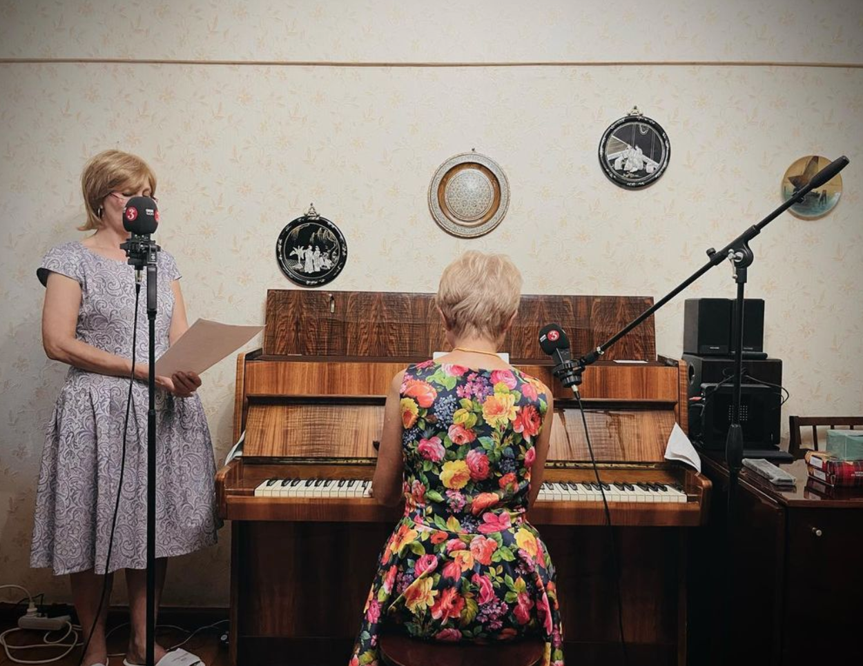 A person sitting at a piano