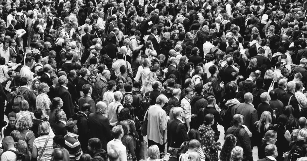 Large crowd of people in black and white