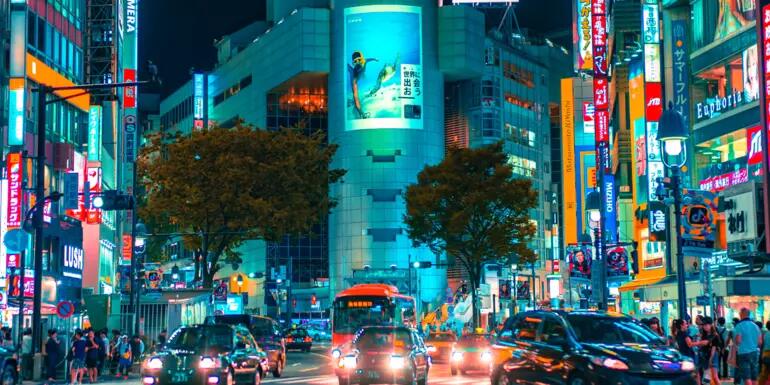 Busy road intersection surrounded with billboards in Shibuya City, Tokyo, Japaan