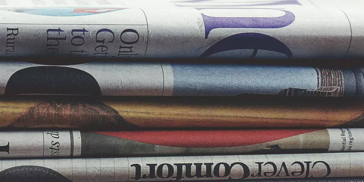 A pile of six newspapers 