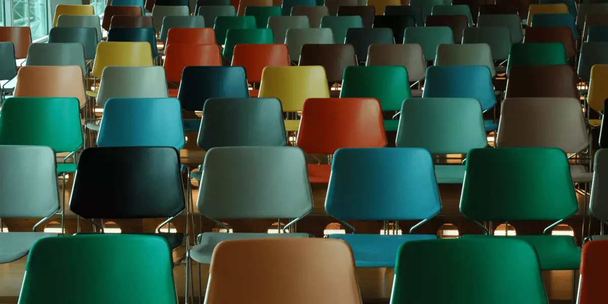 Rows of empty, multicoloured chairs