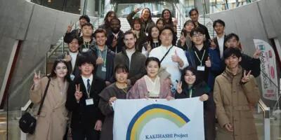 Picture of students in a group with a Kakehashi sign