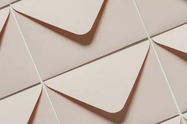 A collage of rose coloured envelopes 
