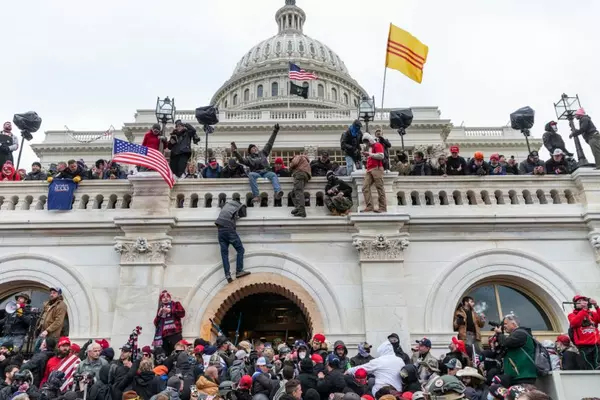 Protesters seen all over Capitol building where pro-Trump supporters riot and breached the Capitol in Washington, DC on January 6, 2021. Rioters broke windows and breached the Capitol building in an attempt to overthrow the results of the 2020 election. Police used buttons and tear gas grenades to eventually disperse the crowd. Rioters used metal bars and tear gas as well against the police. (Photo by Lev Radin/Sipa USA)(Sipa via AP Images)