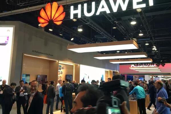 Consumers walking infront of a Huawei Booth
