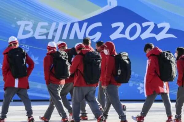A group of athletes walk together at the Beijing Olympics