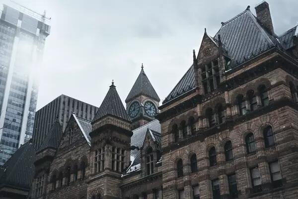 Old City Hall in Toronto, Ontario, with a grey sky background.