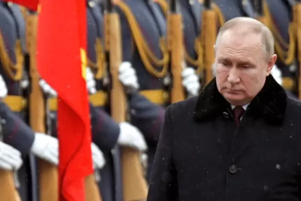 Russian President Vladimir Putin attends a wreath-laying ceremony at the Tomb of the Unknown Soldier, near the Kremlin Wall during the national celebrations of the 'Defender of the Fatherland Day' in Moscow, Feb. 23, 2022.