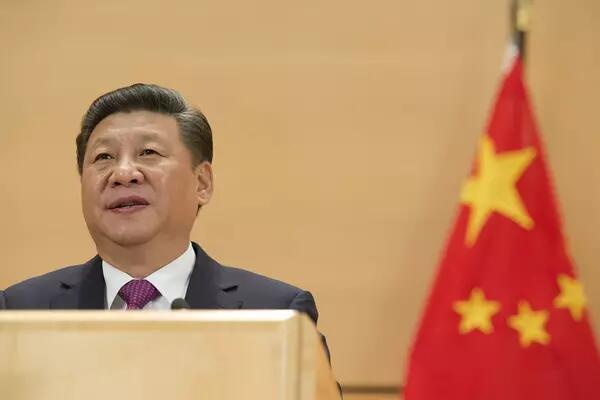 Xi Jinping infront of Chinese flag