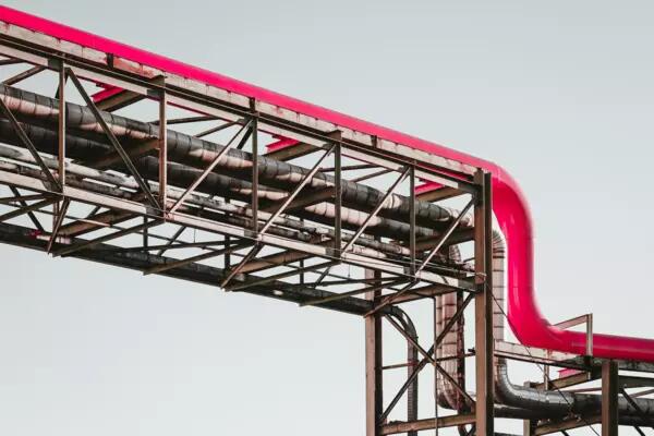 A pink gas pipeline on metal scaffolding