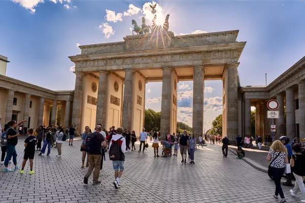 Masked visitors at the Brandenburg Gates in Berlin, Germany
