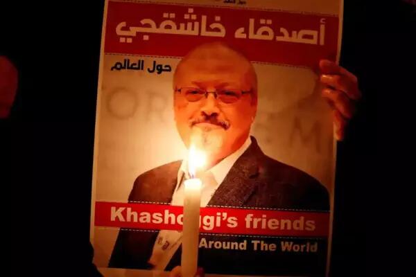 A demonstrator holds a poster with a picture of journalist Jamal Khashoggi outside the Saudi Arabia consulate in Istanbul, 2018. Photograph: Osman Örsal/Reuters