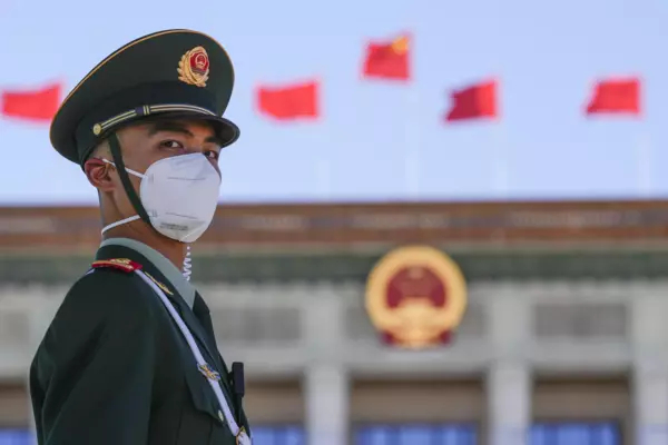 Chinese soldier wears a mask