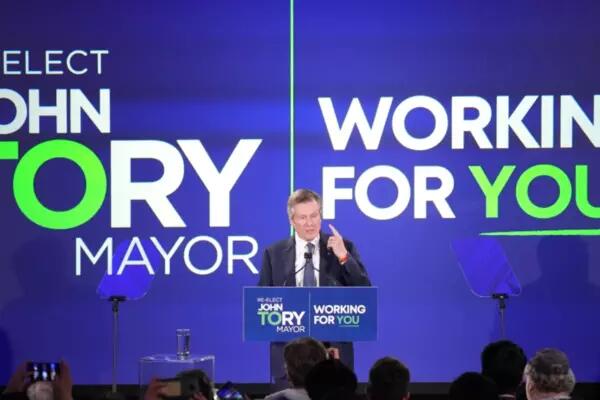 John Tory re-elected, infront of big campaign signage