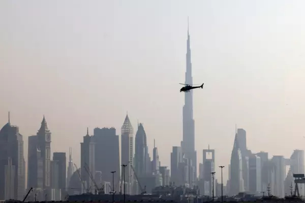 Dubai skyline, with a helicopter in the middle of the image