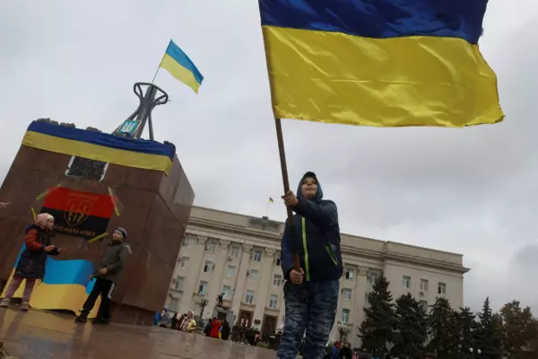Kherson, Ukraine -- a man flying a Ukrainian flag