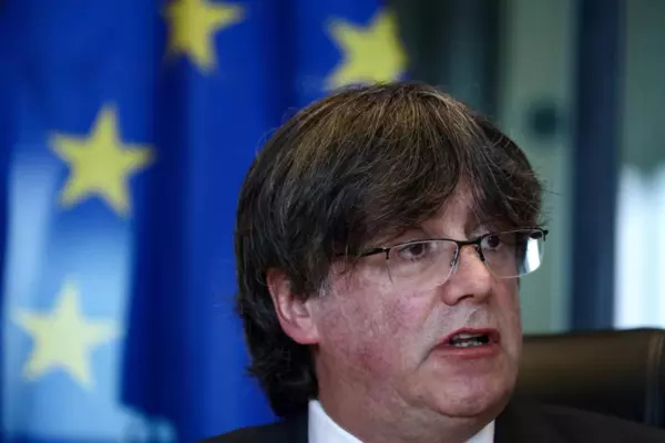 Exiled former Catalan leader and member of European Parliament Carles Puigdemont speaks during a press conference at the EU Parliament in Brussels on April 19, 2022, after Catalan separatists accused Spain of spying on dozens of its leaders’ mobile phones with Pegasus spyware