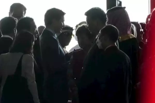 Xi Jinping and Justin Trudeau speak face to face