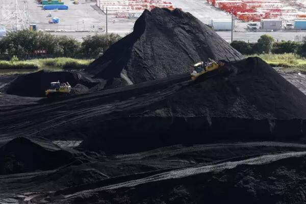 Piles of coal in a storage yard at Takasago Thermal Power Plant in Takasago, Hyogo Prefecture, in August | BLOOMBERG