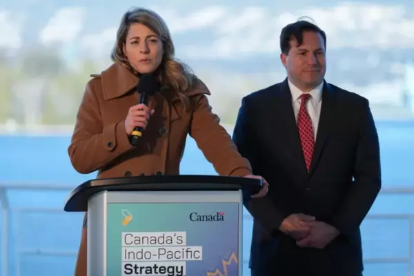 Minister of Foreign Affairs Mélanie Joly responds to questions as Minister of Public Safety Marco Mendocino listens during a news conference to announce Canada's Indo-Pacific strategy in Vancouver on Nov. 27.