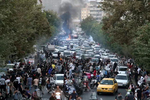 People in Tehran in September protest the death of a woman who was detained by the morality police. (AP) (AP)