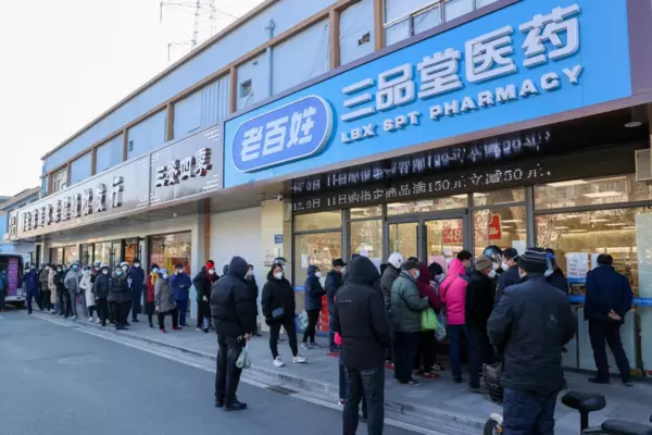 Residents line up to buy medicine at a pharmacy in Wuxi, Jiangsu province, on Dec. 24, 2022.Photographer: CFOTO/Future Publishing/Getty Images