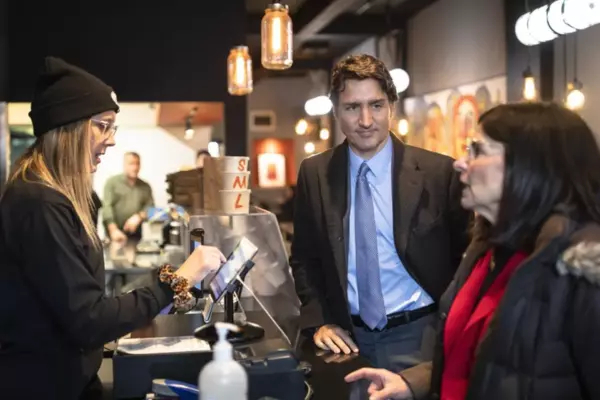 Prime Minister Justin Trudeau and Filomena Tassi, minister responsible for the Federal Economic Development Agency for Southern Ontario, order lunch at the Burnt Tongue restaurant in Hamilton, Ont., ahead of the Liberal cabinet retreat, on Jan. 23, 2023.