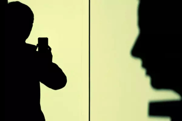 Silhouette of someone taking a photo