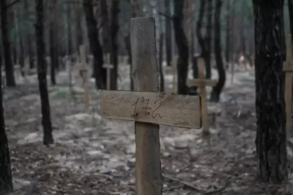 Numbered crosses at a mass grave site in the town of Izium in Kharkiv region, Ukraine on Sept. 16, 2022. (Gleb Garanich/Reuters)