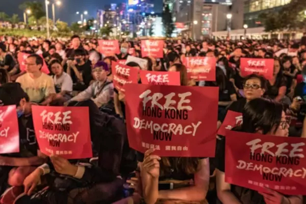 Activists hold up pro-democracy placards at a rally in Hong Kong in June 2019. University of Toronto professor Joseph Wong explains that 'democracies emerge through weakness... in which the autocratic regime collapses under the weight of its own illegitimacy.' (Anthony Kwan/Getty Images)