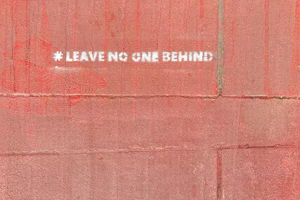 Leave no one behind on red background