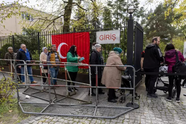 Turkish citizens wait in line outside the consulate during early voting in the Turkish general elections in Berlin on April 27. MAJA HITIJ/GETTY IMAGES