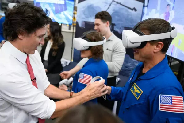 Trudeau with a person wearing VR technology