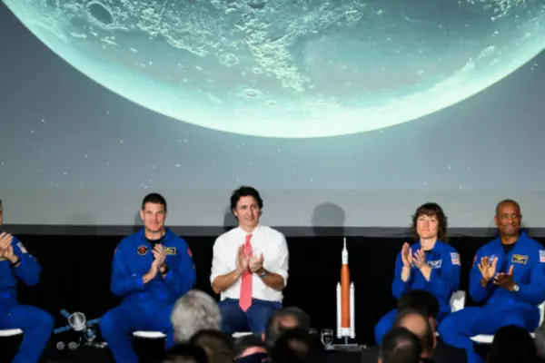 The crew of Artemis II, Reid Wiseman, second from left, Jeremy Hansen, Christine Hammock Koch and Victor Glover, are applauded by Canadian Space Agency President Lisa Campbell, left, Prime Minister Justin Trudeau, and NASA Administrator Bill Nelson, right, during a presentation at the Canada Aviation and Space Museum in Ottawa, on Tuesday, April 25, 2023. Justin Tang/The Canadian Press.