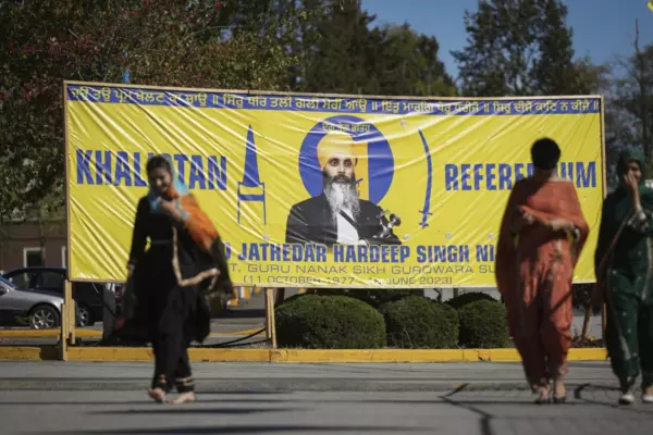 A photograph of late temple president Hardeep Singh Nijjar is seen on a banner outside the Guru Nanak Sikh Gurdwara Sahib in Surrey, British Columbia, on Monday, Sept. 18, 2023, where temple president Hardeep Singh Nijjar was gunned down in his vehicle while leaving the temple parking lot in June. Canada expelled a top Indian diplomat Monday as it investigates what Prime Minister Justin Trudeau called credible allegations that India’s government may have had links to the assassination in Canada of a Sikh ac
