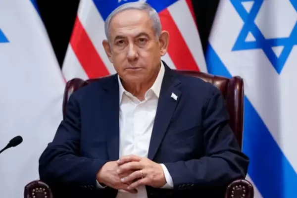 Israeli Prime Minister Benjamin Netanyahu listens as he and U.S. President Joe Biden participate in an expanded bilateral meeting with Israeli and U.S. government officials on Wednesday in Tel Aviv.