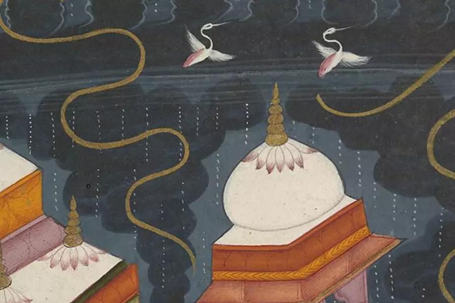 Detail from painting with the side and roof of a building, flowers, and birds flying in the sky. 