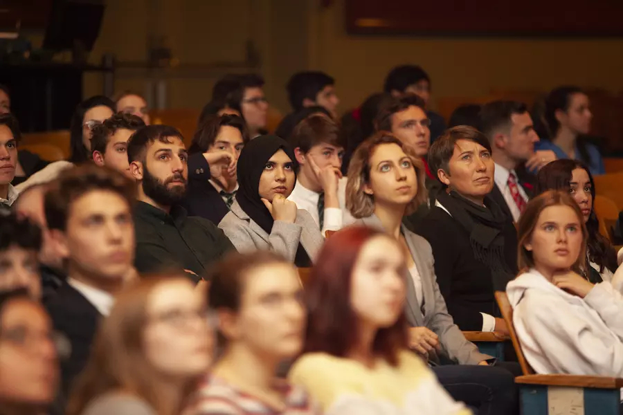 A crowd of GII students sit in an auditorium
