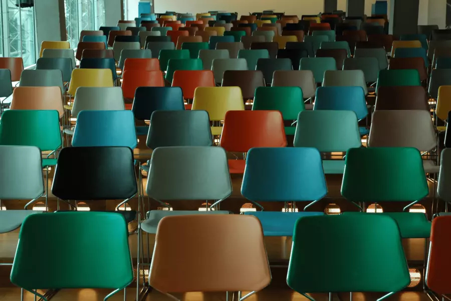 Rows of empty, multicoloured chairs
