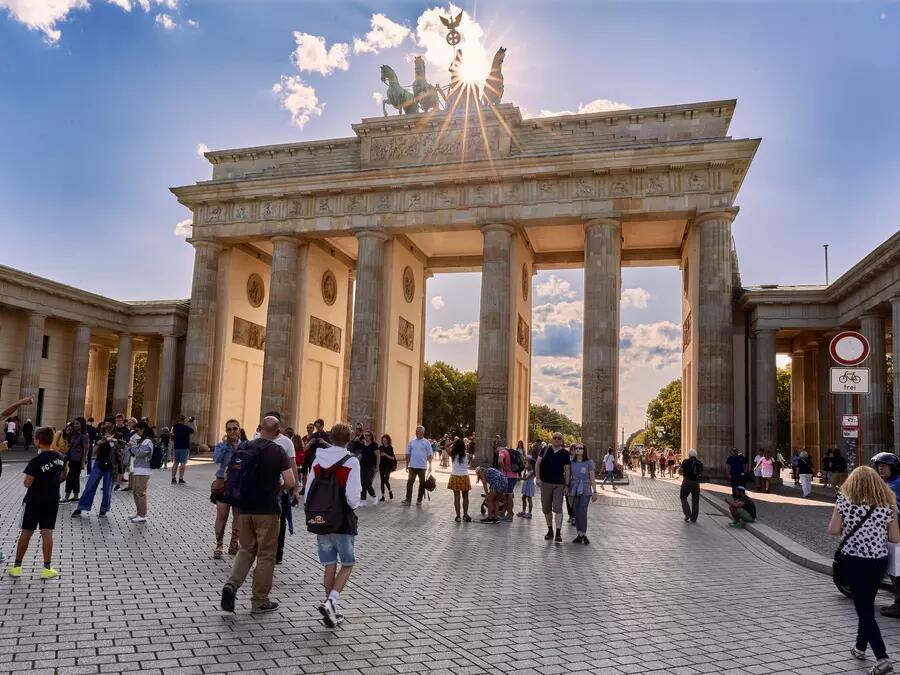 Masked visitors at the Brandenburg Gates in Berlin, Germany