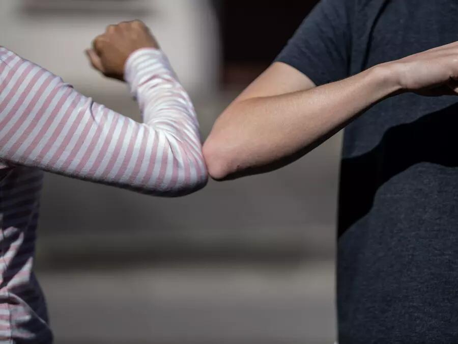 The elbow bump is an informal greeting where two people touch elbows. Interest in this greeting was renewed during the avian flu scare of 2006, the 2009 swine flu outbreak, the Ebola outbreak of 2014, and the 2019-20 COVID-19 pandemic when health officials supported its use to reduce the spread of germs.